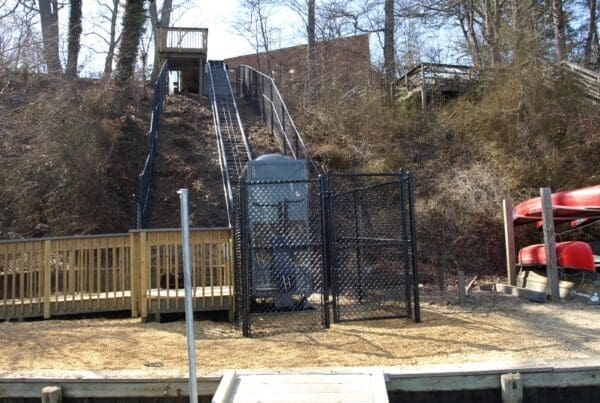 Hill Tram system provides access for wheelchair students to the waters edge at public school outdoor education facility in Maryland