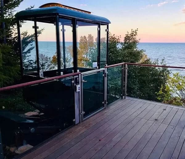 outdoor hillside elevator tram on deck next to Lake Michigan