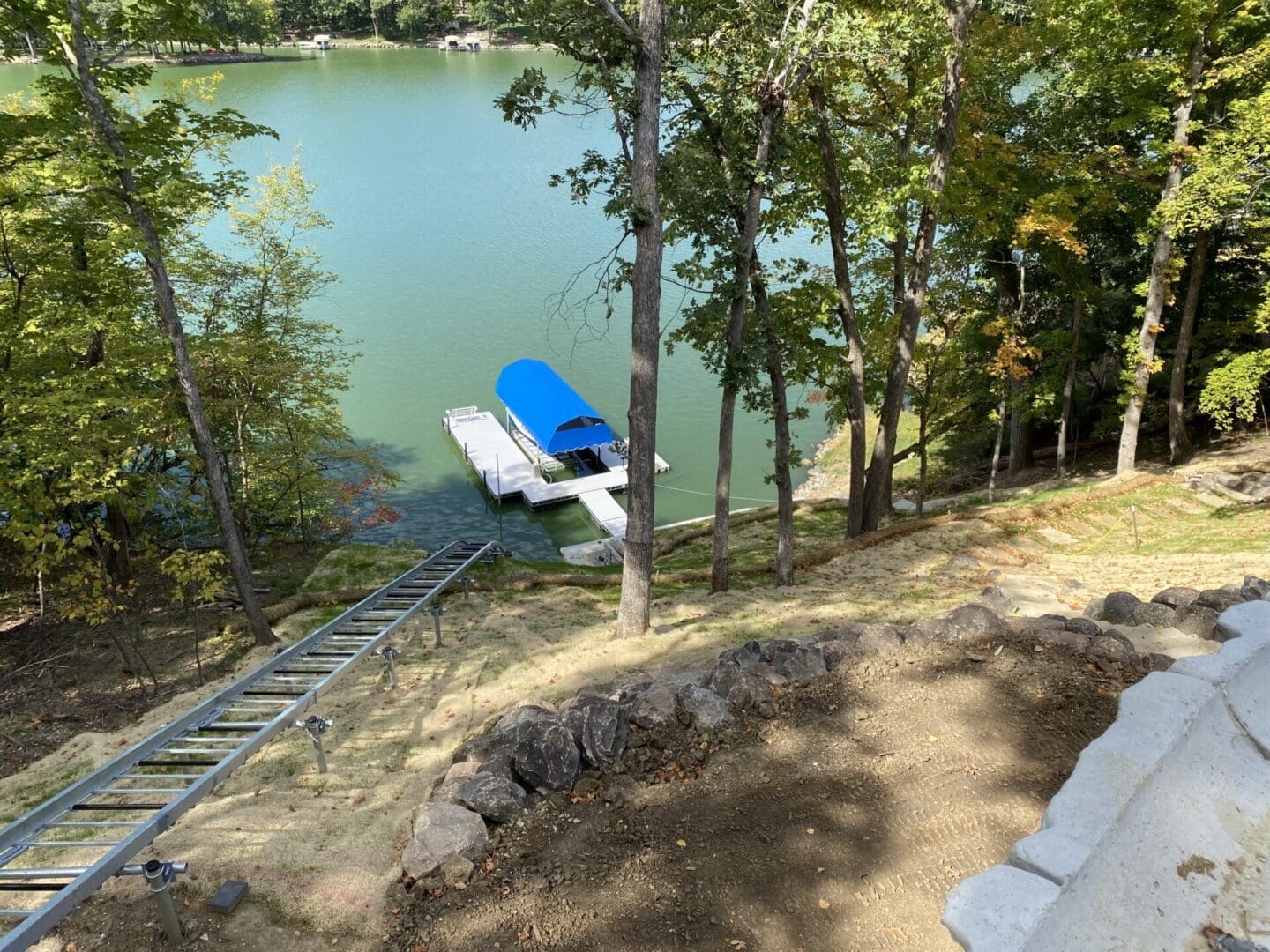 Hill Hiker's elevator lift tracks on helical posts provide lakeside access to the dock