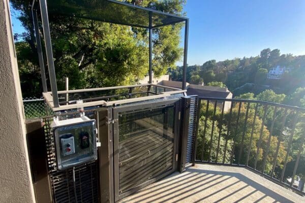 Los Angeles residential funicular parked at top landing with controls and gate