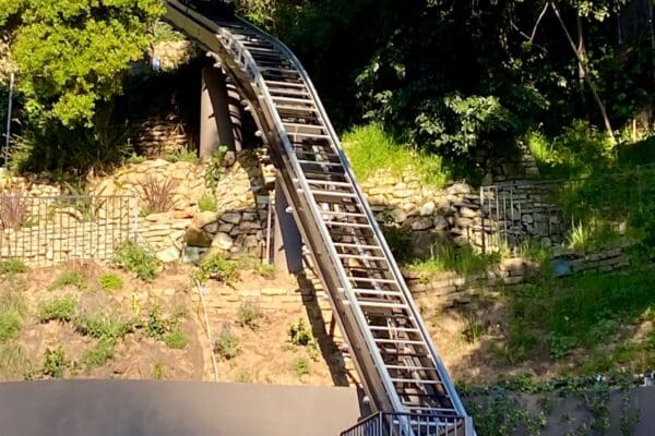 Private funicular on special curved elevator rail track conturing to the hillside in California