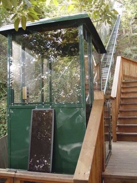 Bay area personal funicular lift with fully custom cart with solar pannel parked at lower landing