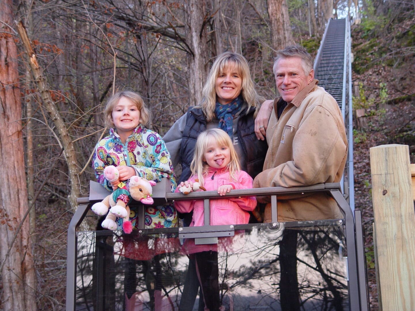 Happy family riding their new Hill Hiker outdoor hill tram