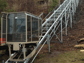 Hill Hiker outdoor tram system with helical screw piles support structure