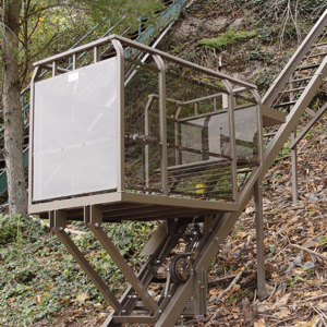 Hill Hiker inclined elevator with standard steel construction, powder coat painted track rail and powder coat painted car finish