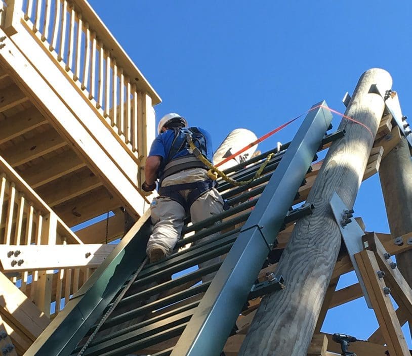 Hill Hiker Technician working on new inclined elevator installation