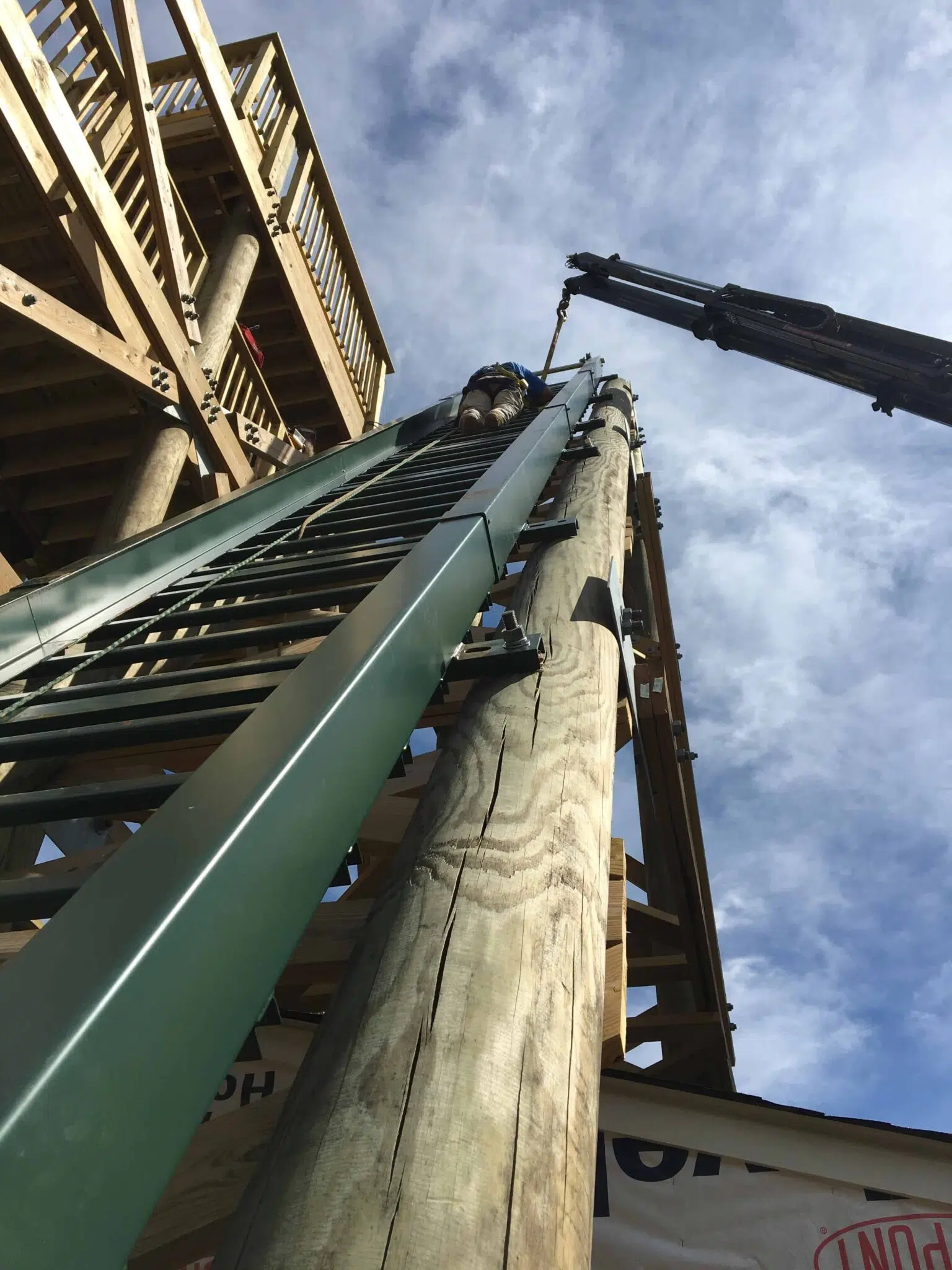 Installing the Outdoor Inclined Elevator Lift Track Rails During Construction of the Patuxant River Observation Tower