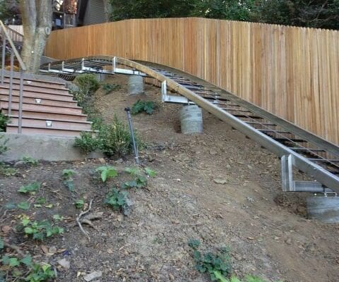 Hill Hiker home elevator with curved rail design contours to the natural landscape