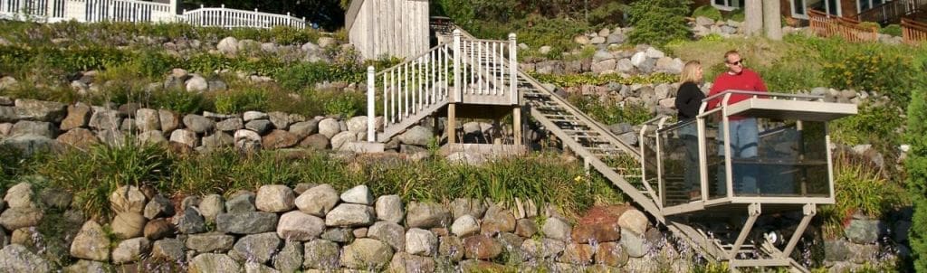 Residential Hill Hiker in use by a happy couple at a home with beautiful landscaping.