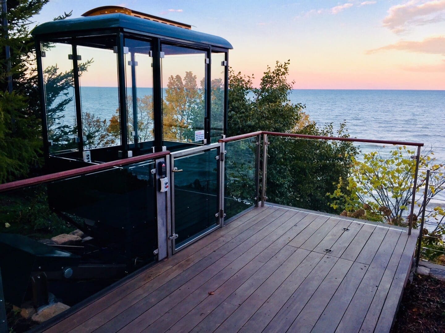 Hill Hiker funicular cable car on lake michigan at sunset
