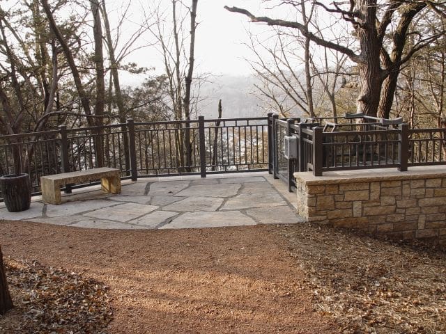 Lakeshore lift tram upper landing with stone work and custom metal railing